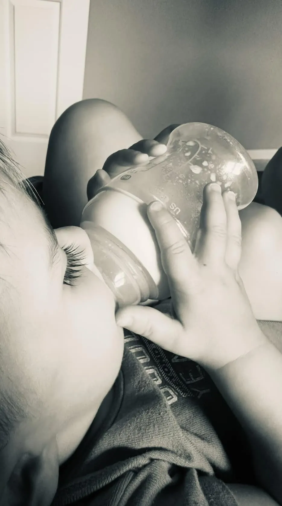 A baby being fed with a bottle