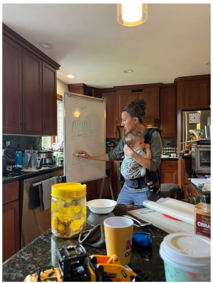 Korilynn teaching a bread class, hands working dough on a kitchen counter